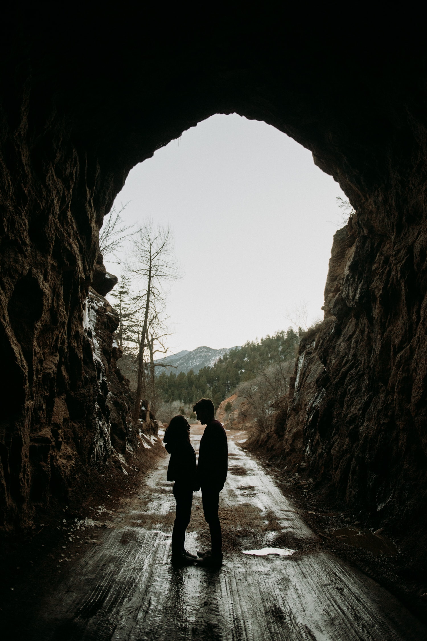 couple standing in a cave in colorado