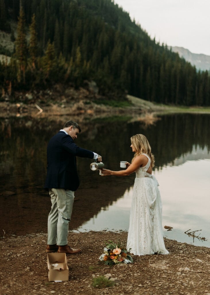 Bride and groom pouring coffee together during their hiking elopement in Aspen, Colorado. Elopement ideas for the adventurous couples.