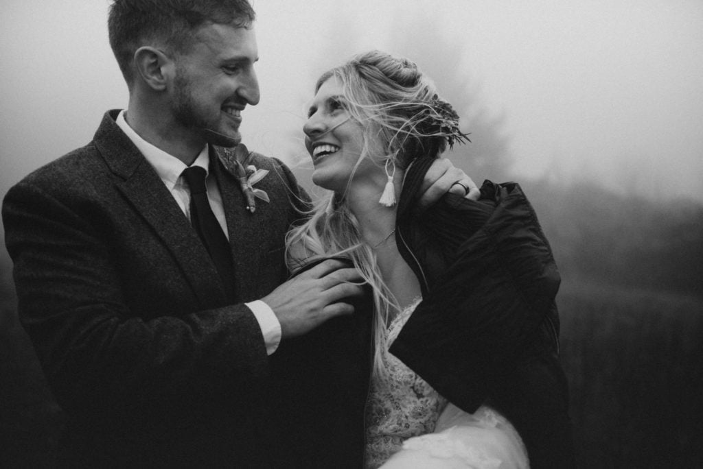 bride and groom smiling at each other at their elopement