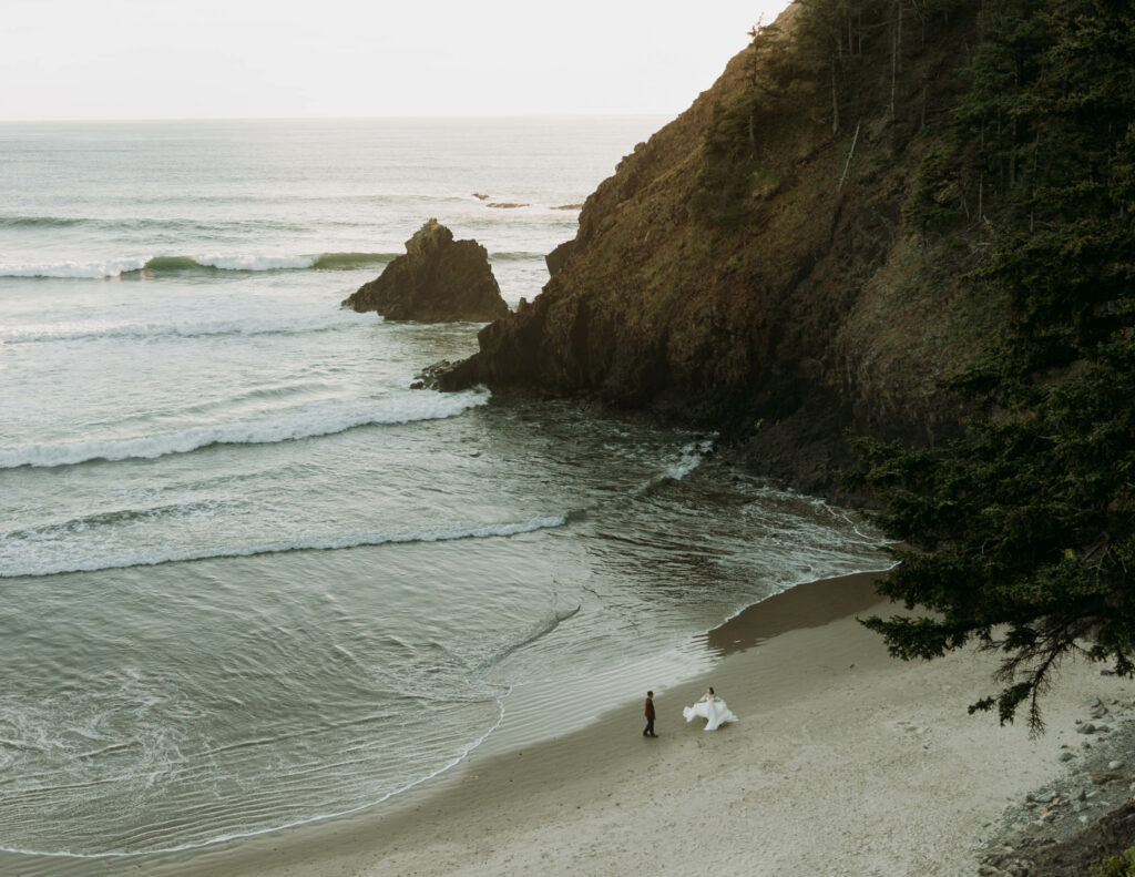 A couple dancing on the beach during their elopement at Ecola State Park in Oregon, one of the best places to elope in the Pacific Northwest!