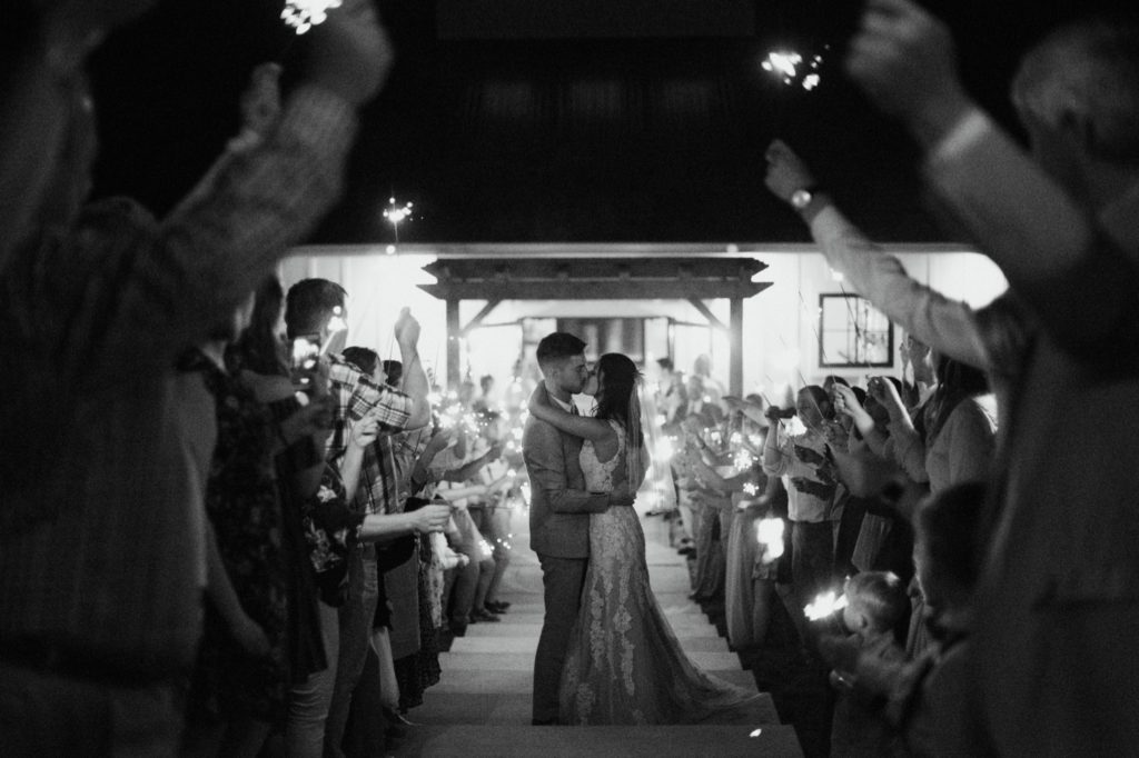 Black and white sparkler exit after an emotional and beautiful intimate wedding ceremony in Bloomington.