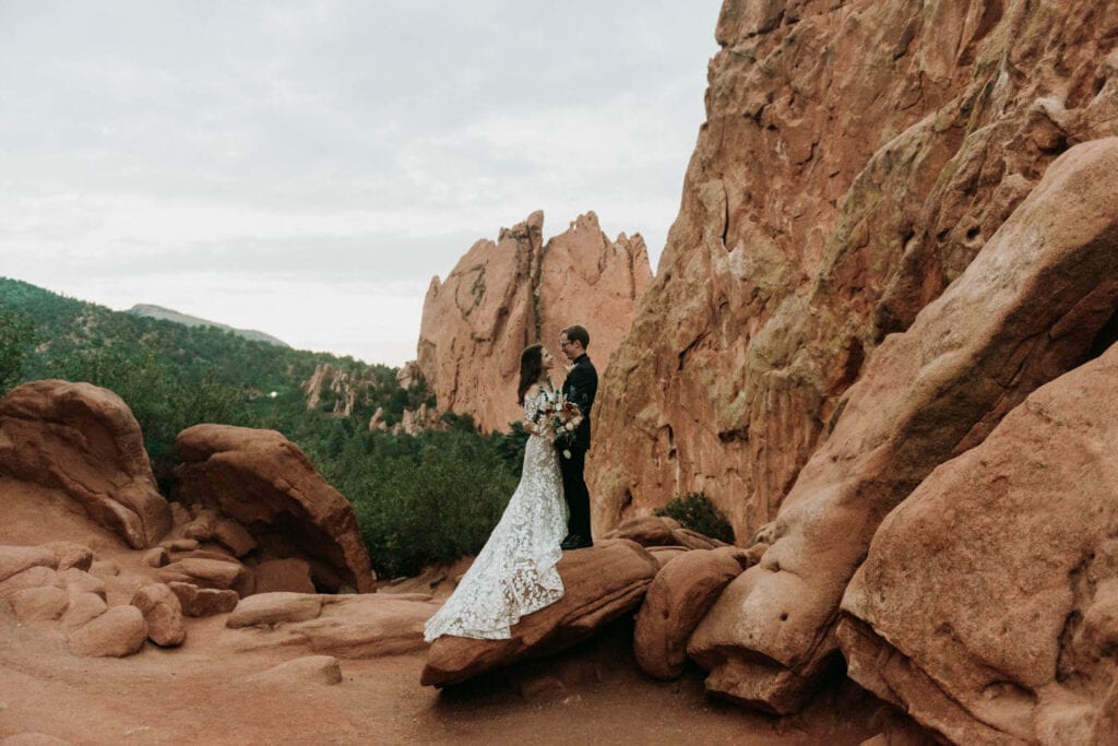 Rock formations frame a wedding couple at garden of the gods in colorado springs