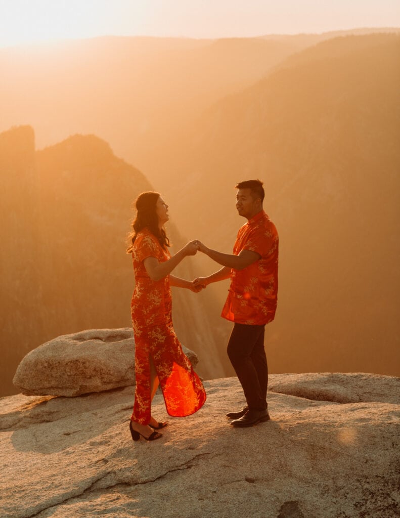 A couple dancing on the edge of a cliff at Taft Point during their Yosemite elopement