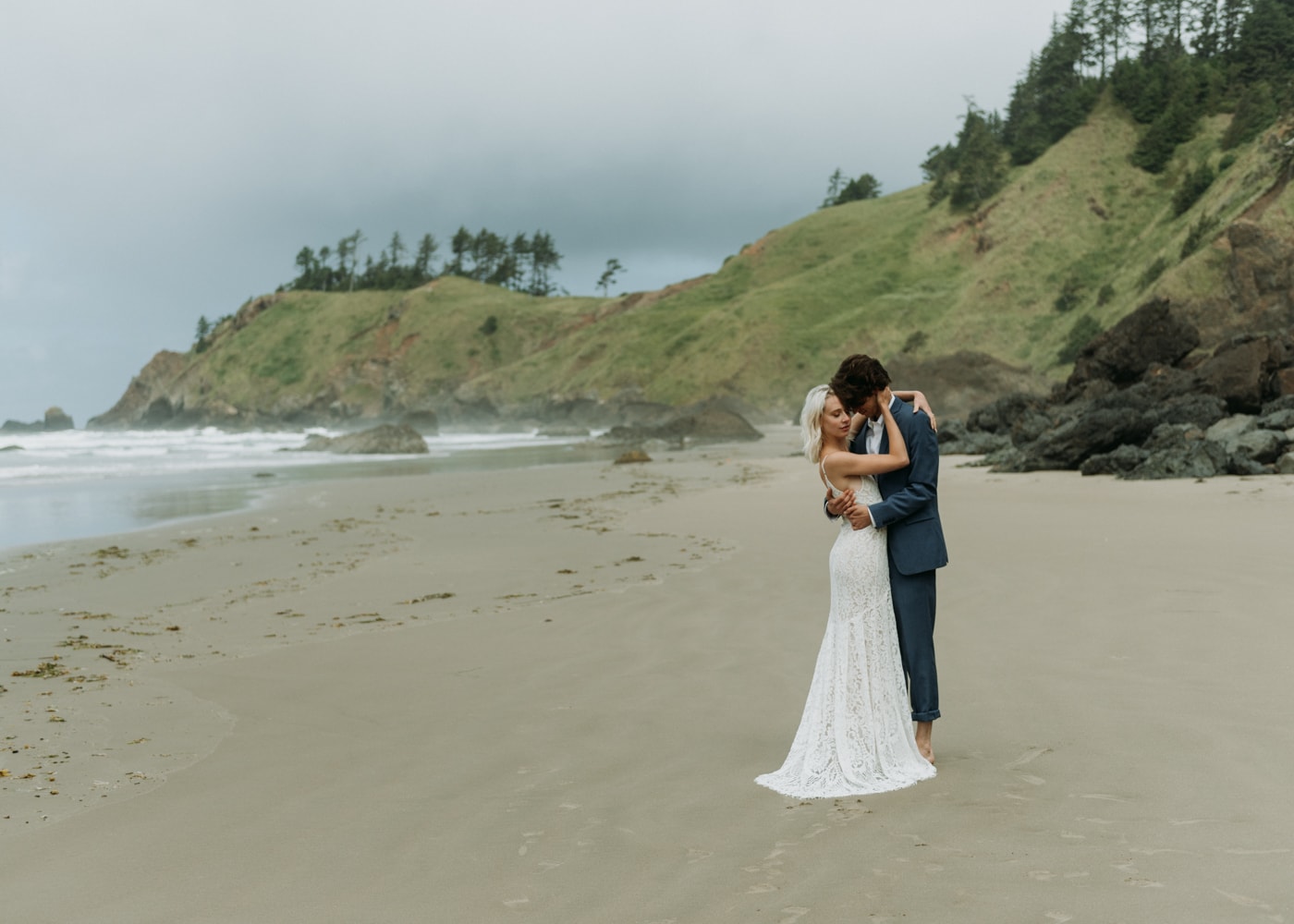 couple embracing on the beach in mexico during their elopement