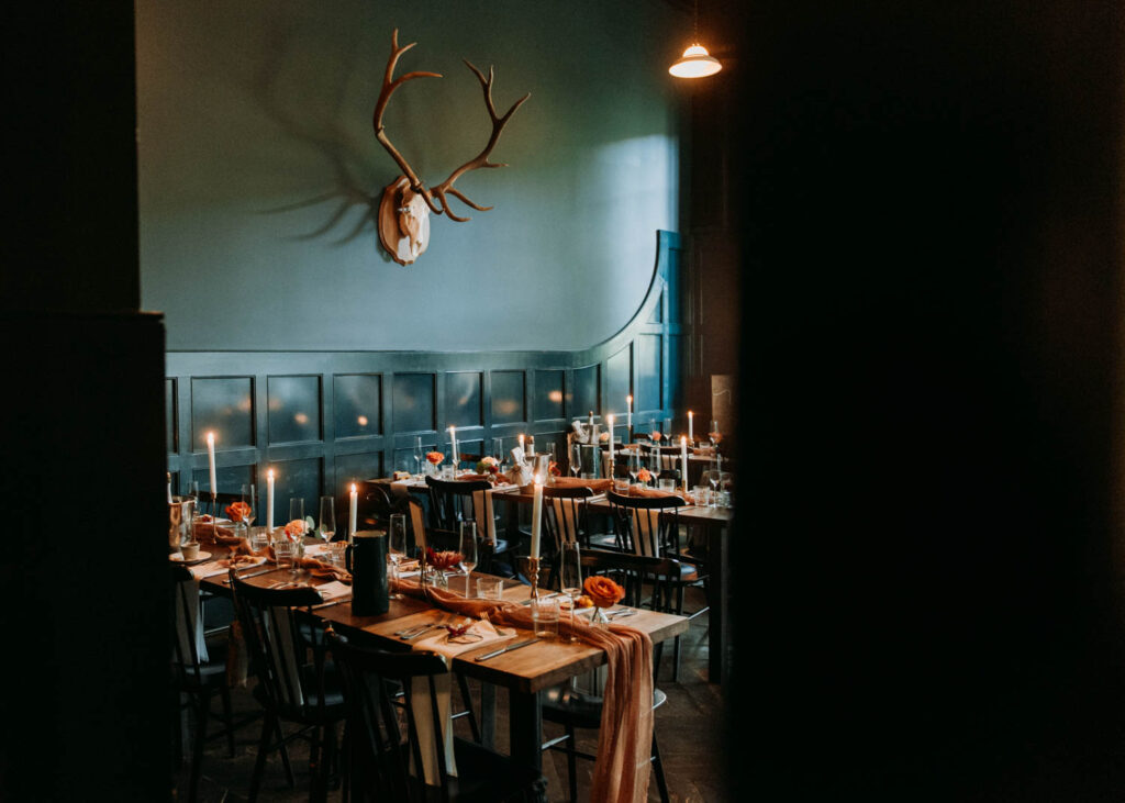 Tablescapes are set up against the wall in the private dining room at the Surf Hotel in Buena Vista, an amazing micro wedding venue