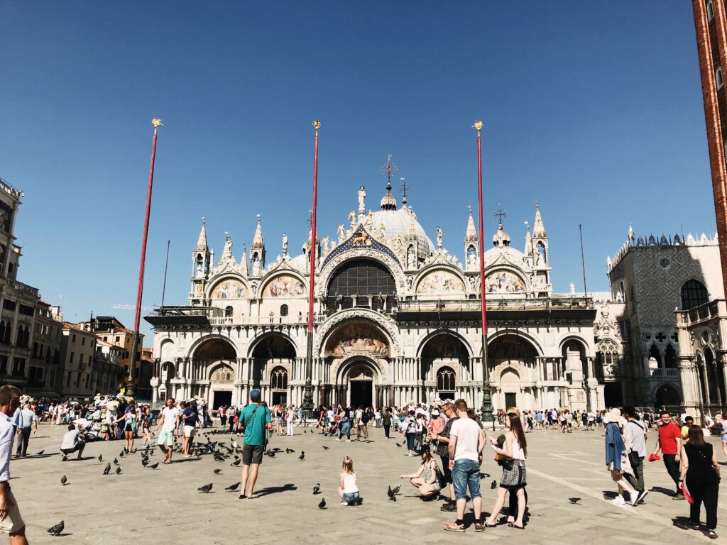 People wandering around outside of St Mark's Basilica. How to elope in Venice, Italy