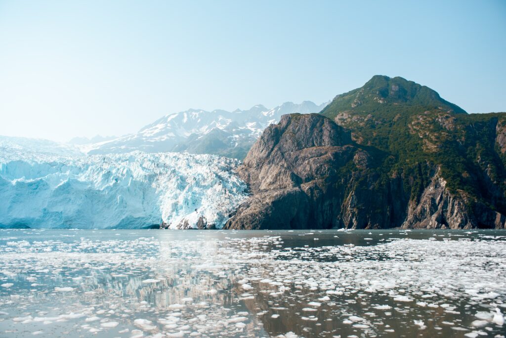 a mountain and glacier in front of a fjord in kenai fjords national park during an elopement