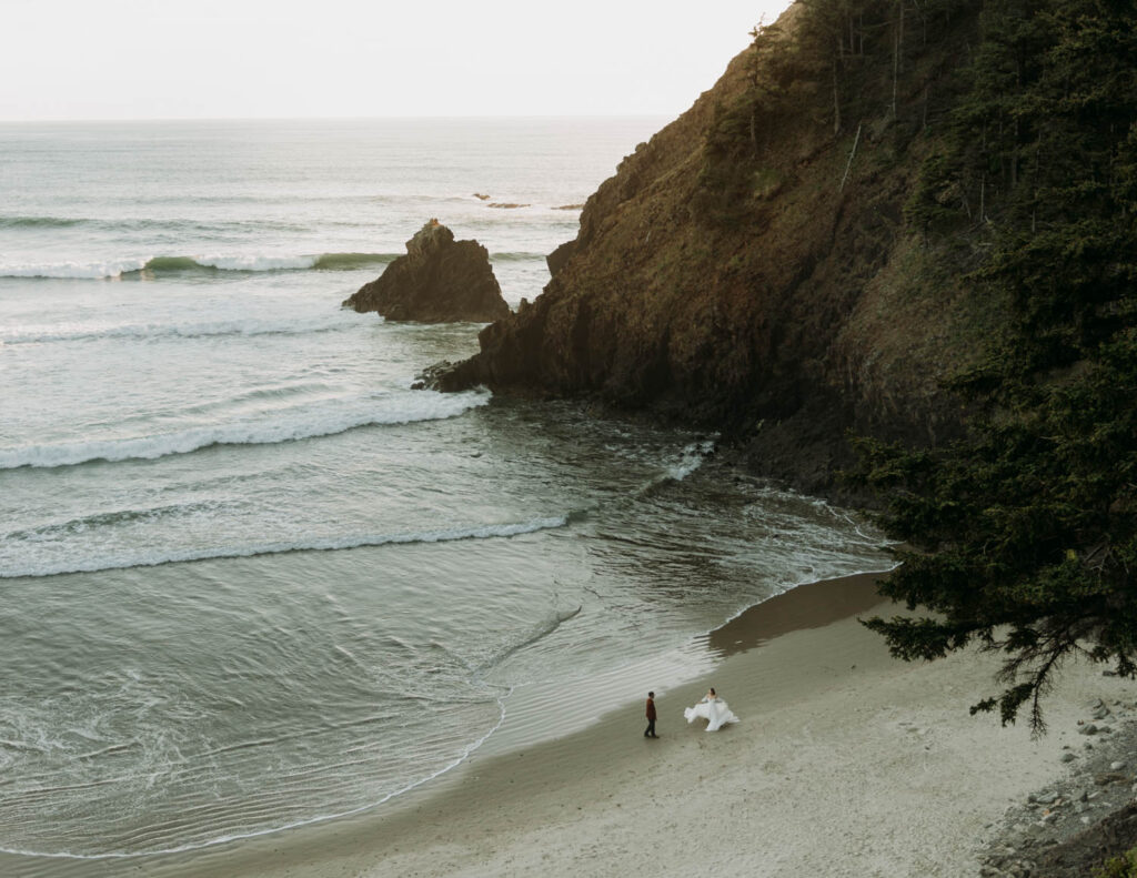 A couple dancing on the beach during their elopement at Ecola State Park in Oregon, one of the best places to elope in the Pacific Northwest!  This is one of the best places to elope