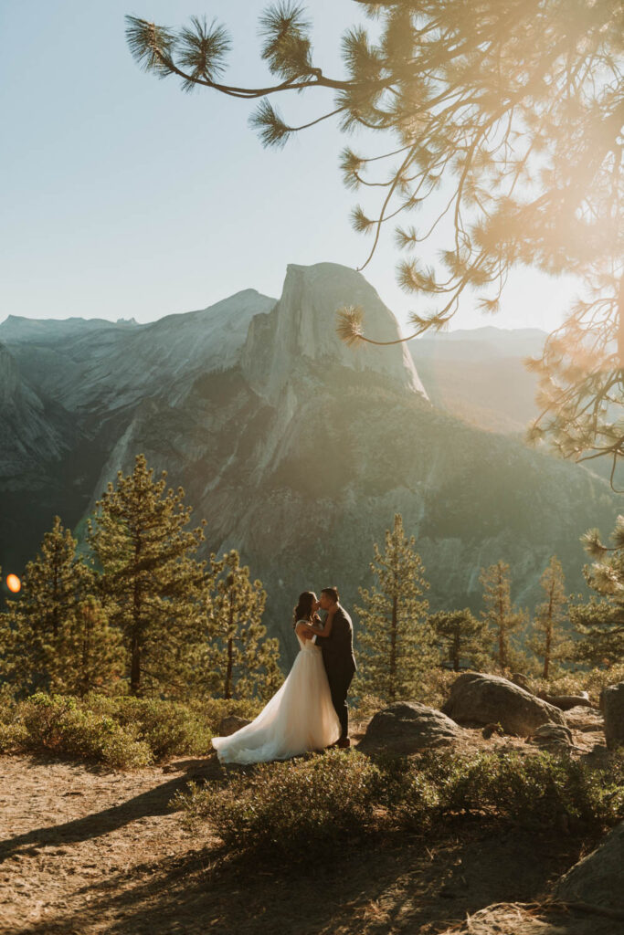 A couple exploring Glacier Point in Yosemite National Park, California, one of the best places to elope in the US!