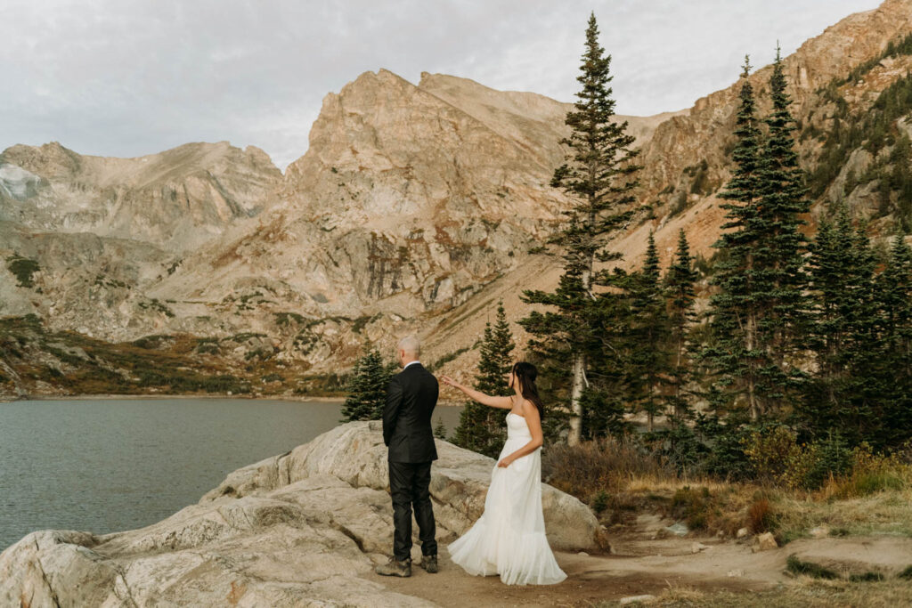 A wedding couple shares their first look at their Lake Isabelle elopement