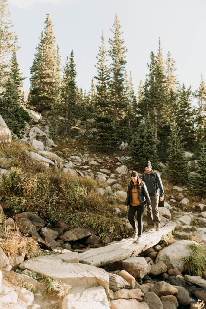 After their elopement, a couple hikes back down from Lake Isabelle