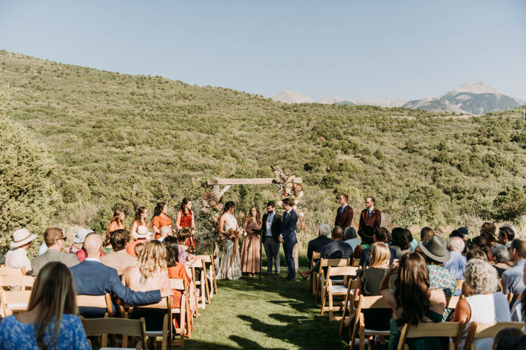 wedding ceremony in the late summer at whispering oaks ranch, one of the best small wedding venues in moab, utah