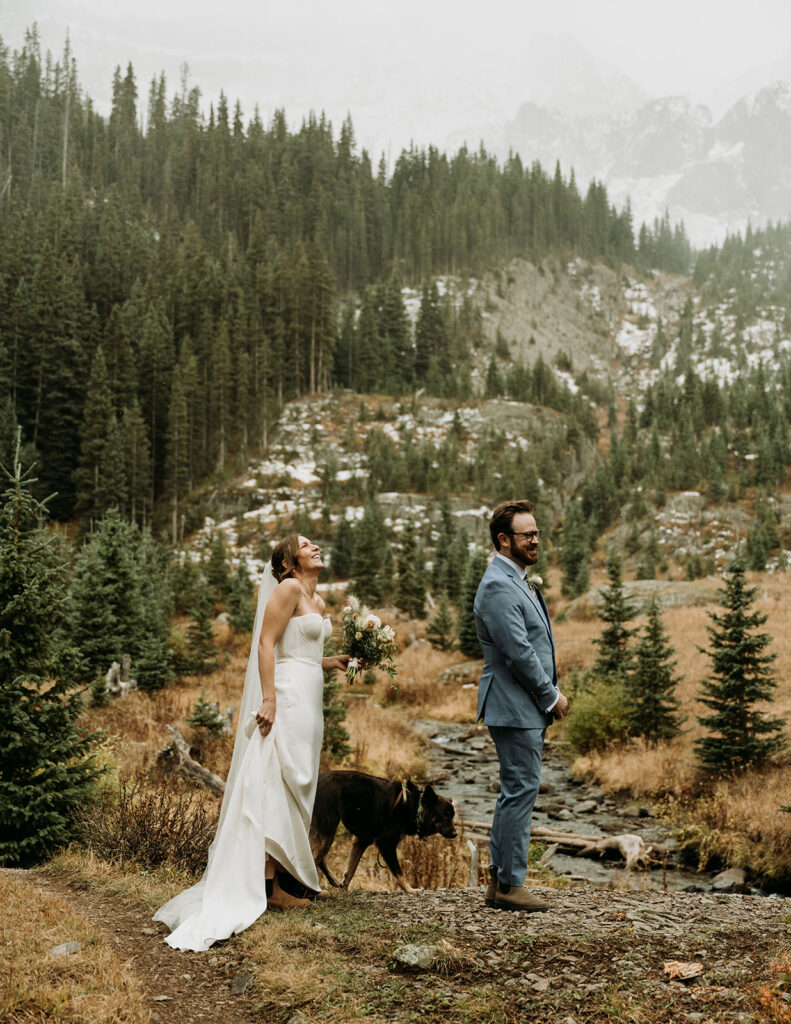 A couple shares a first look during their fall hiking elopement in the San Juan Mountains of Colorado