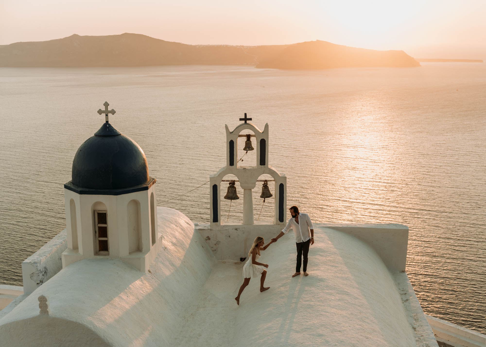Santorini Elopement at an iconic blue domed church