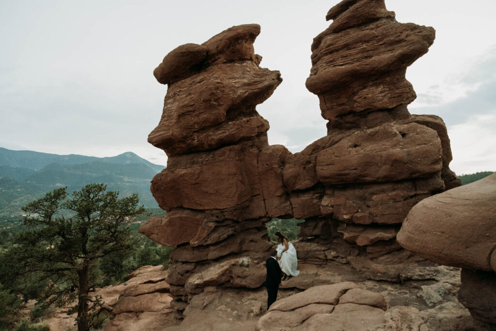 sunset hike at garden of the gods' siamese twins during an elopement