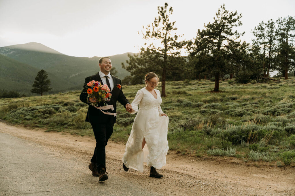 A couple runs during sunset for their rocky mountain elopement