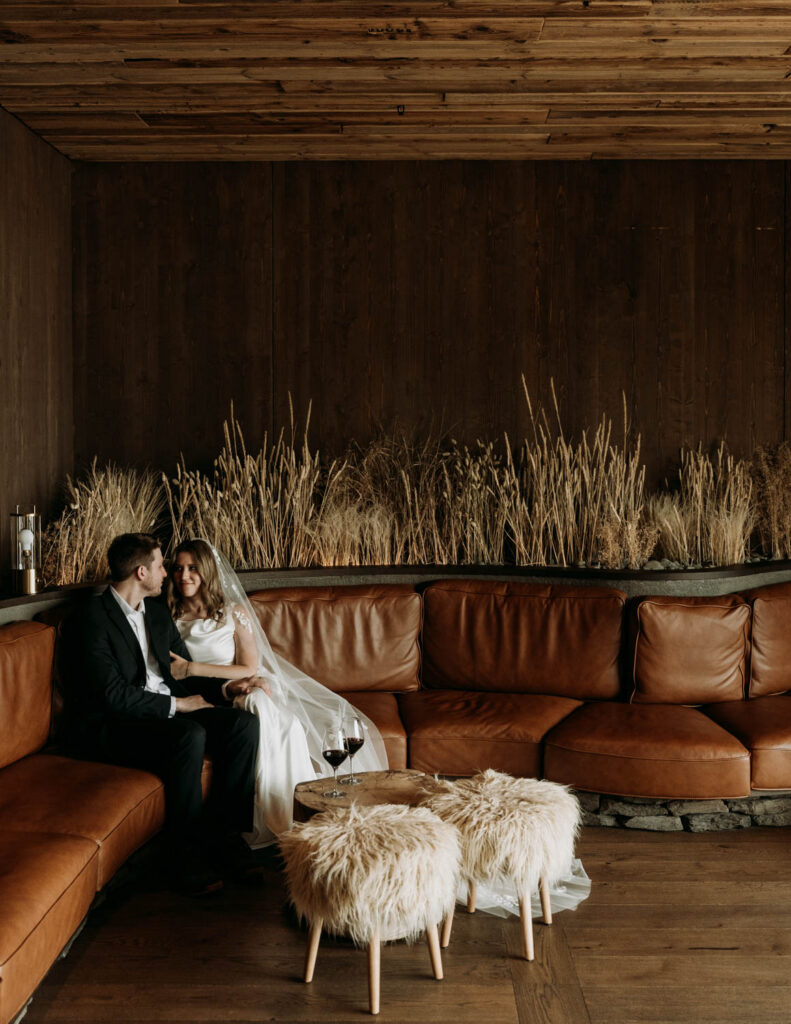 sharing a drink before their Stokksnes elopement at Hotel Jokulsarlon